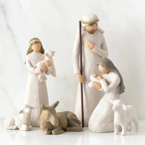 A complete 20-piece handmade wooden nativity set displayed, showcasing rustic Christmas charm