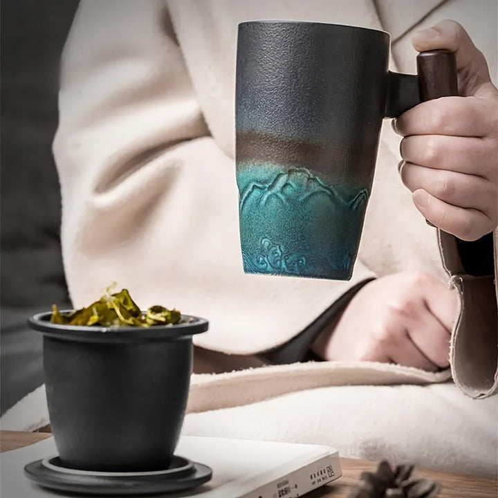 Practical ceramic tea mug with integrated infuser & wooden handle, designed for easy loose leaf tea brewing.