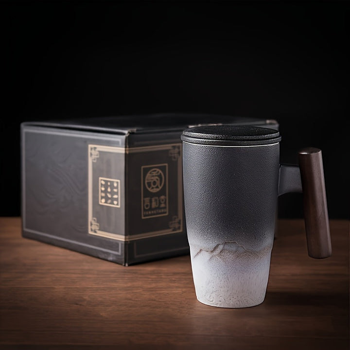 Stylish handmade ceramic tea mug with infuser & wooden handle, a great addition to your kitchen drinkware.