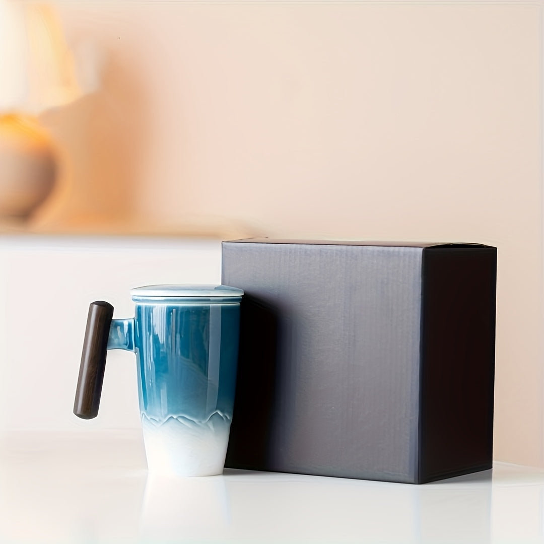 Handmade ceramic mug, complete with a removable loose leaf infuser and a sturdy, comfortable wooden handle.