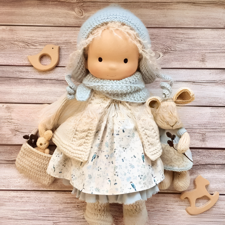 The simple design of this Waldorf cuddly doll encourages creative interpretation.