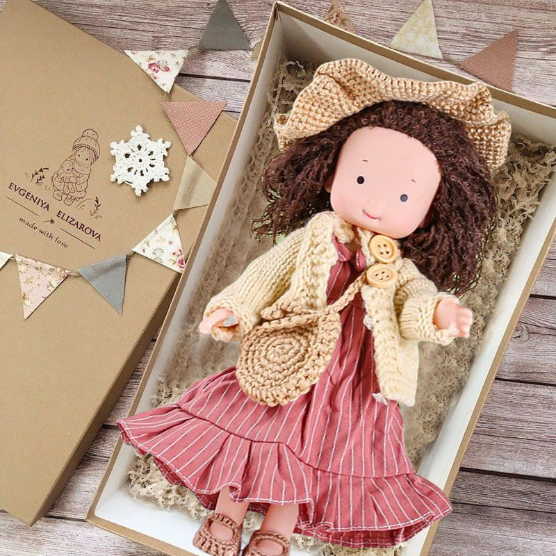 Child holding a soft handmade Waldorf doll, fostering imaginative play and emotional connection.