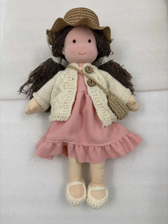 A beautiful, handmade natural toy doll, ideal as a cherished heirloom for children.