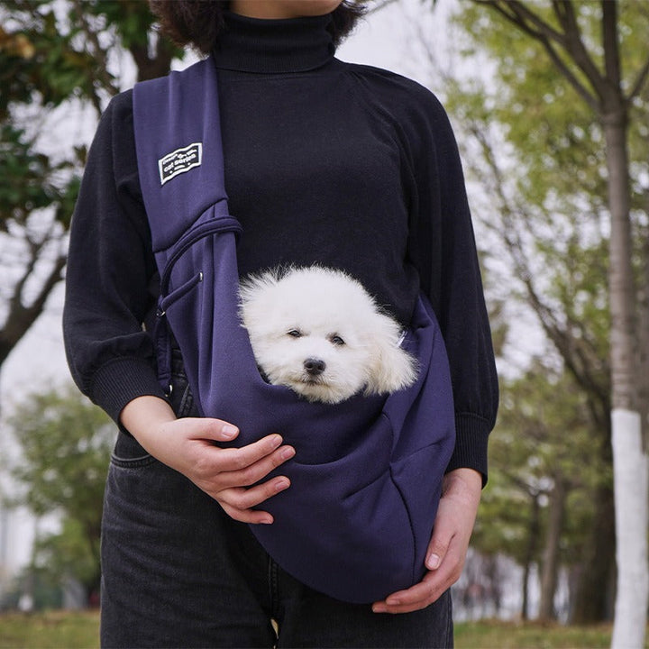 Hands-free dog carrier sling for small to medium pets, perfect for travel & everyday comfort.