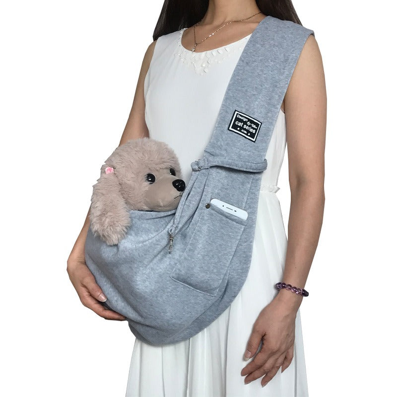 Reversible & washable hands-free pet sling, ideal for small to medium dogs and puppies, offering comfort.