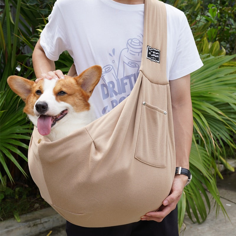 Comfortable hands-free dog carrier sling for small and medium dogs, great for outdoor adventures & travel.