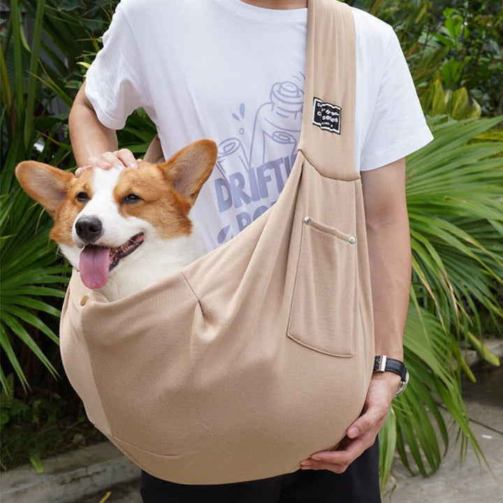 Comfortable hands-free dog carrier sling for small and medium dogs, great for outdoor adventures & travel.