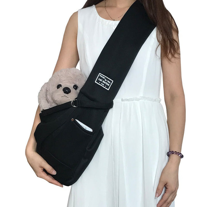 Secure & comfortable hands-free dog carrier sling for small to medium pets, perfect for travel & outdoor use.