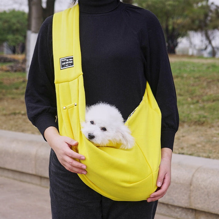 Ergonomic hands-free dog carrier sling for small to medium pets, essential travel gear and pet accessory.