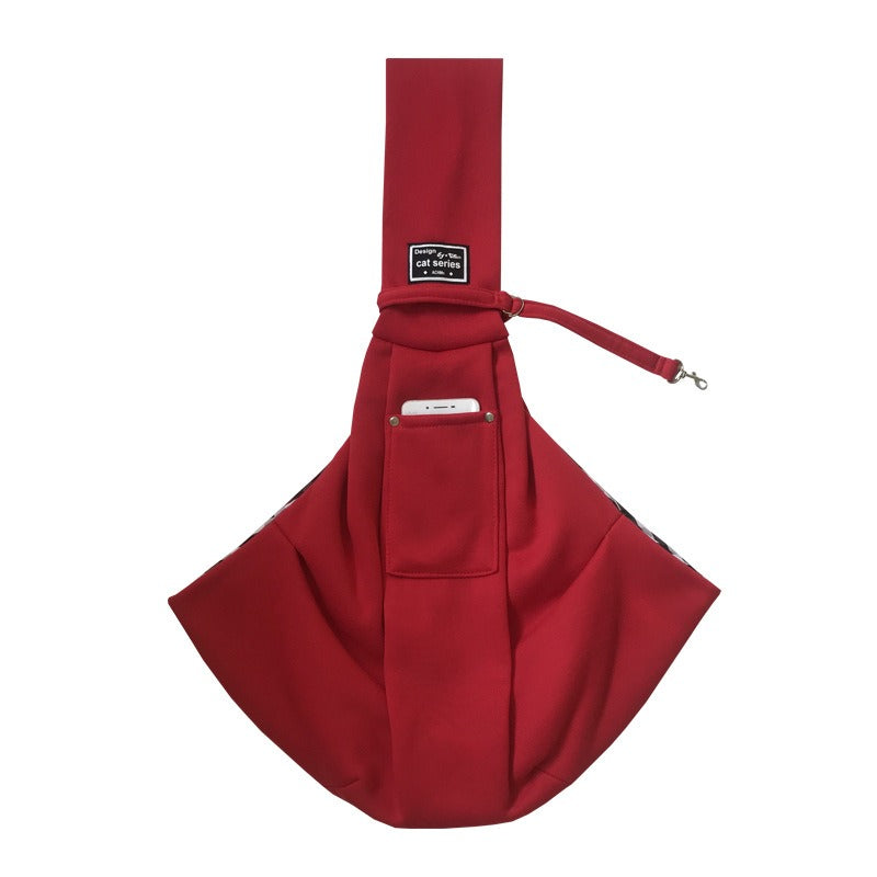 Soft, reversible hands-free pet sling for small and medium dogs, perfect for comfortable outdoor adventures.
