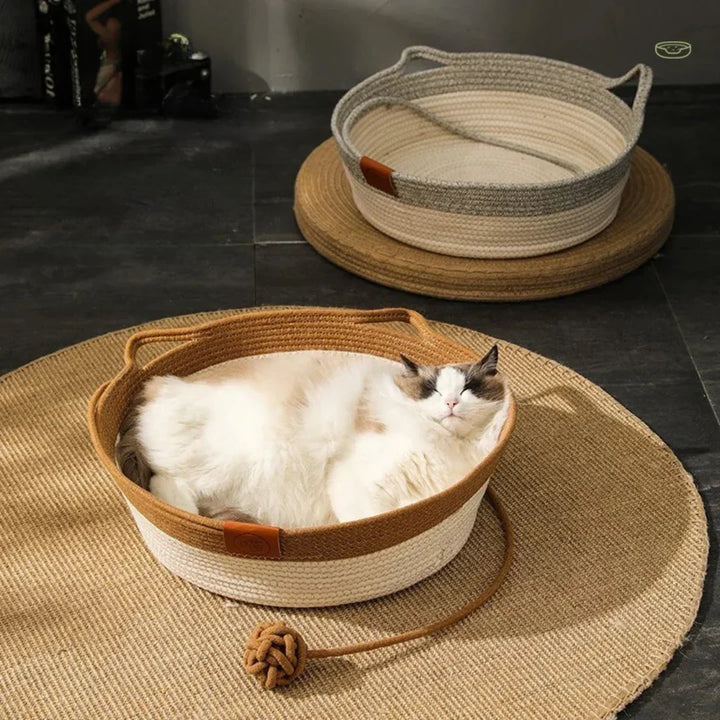 Handwoven cotton rope cat bed in grey, providing cozy comfort for feline pets. Durable & eco-friendly pet furniture.