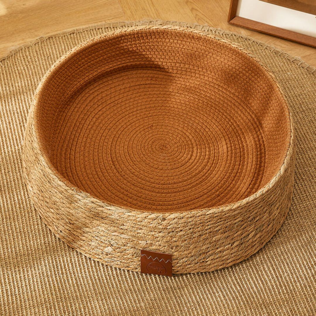 Natural pet product: a chic rattan cat bed designed for scratching and lounging.