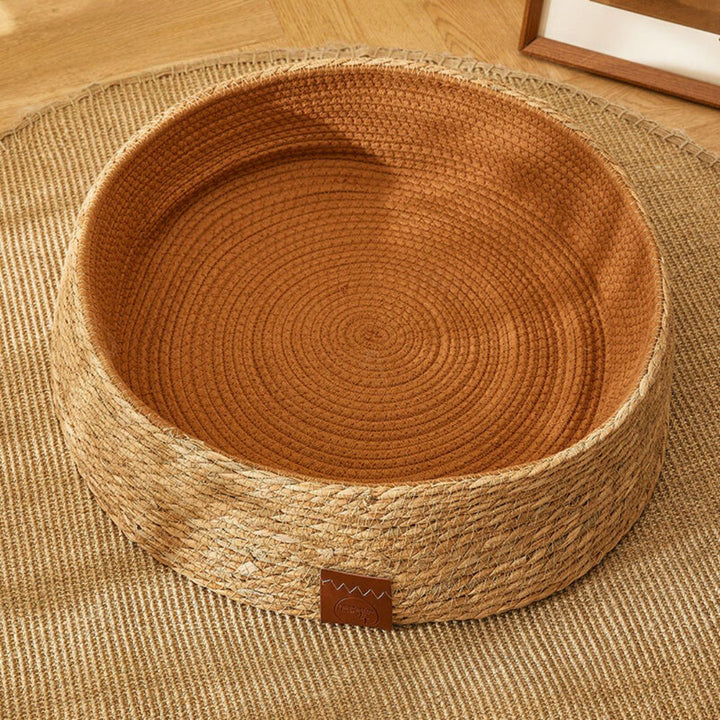 Natural pet product: a chic rattan cat bed designed for scratching and lounging.