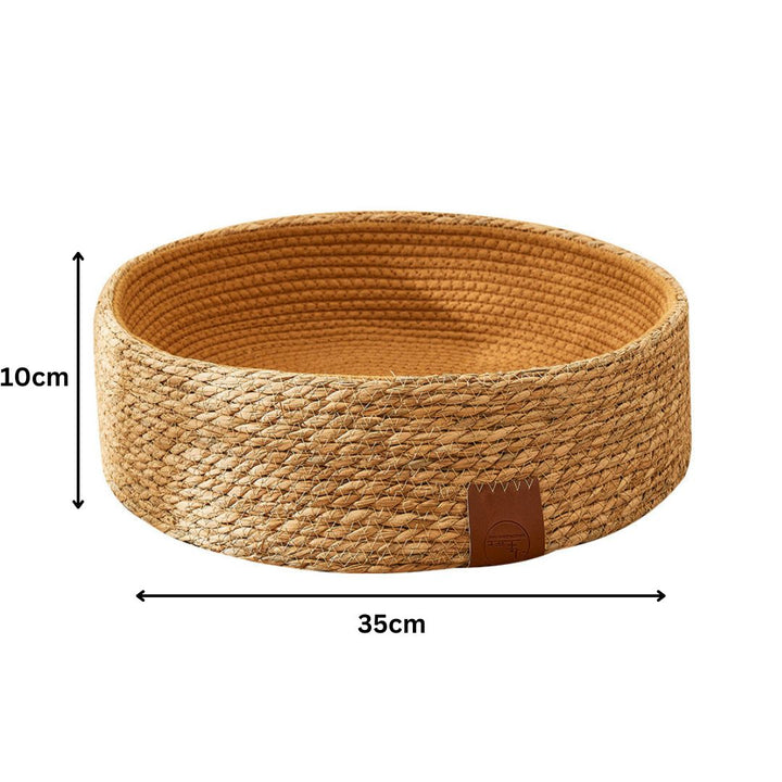 Elevated rattan cat bed with scratching texture, offering comfort and stylish design.