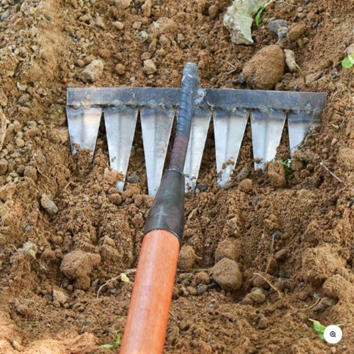 Essential gardening equipment: heavy-duty steel garden rake for quick weed removal & lawn cultivation.