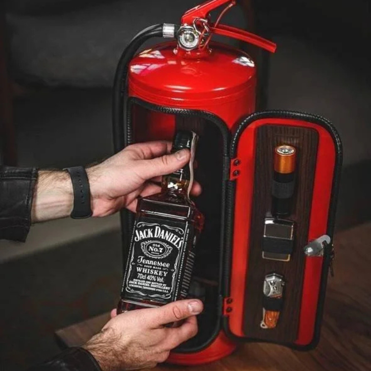 Open HiddenFlame mini bar, revealing liquor bottles & glasses inside its unique fire extinguisher design.