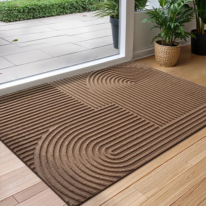 Quick-drying entryway floor mat traps dirt & moisture, featuring a non-slip design for safe indoor/outdoor use.