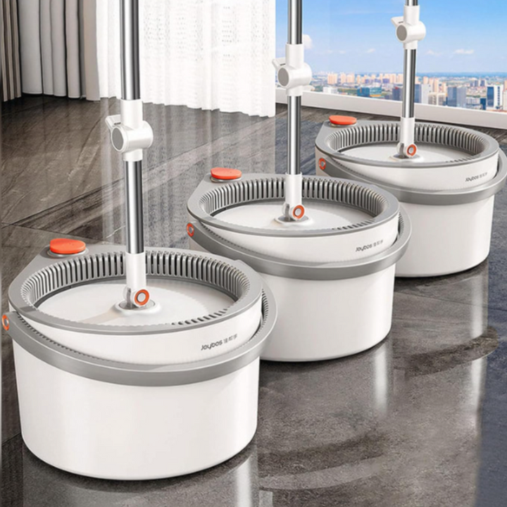 Household Self-Cleaning SpinMop system with reusable microfiber mop head for easy floor cleaning.