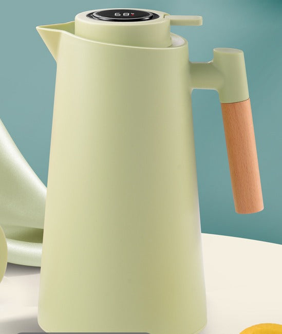 Functional and attractive insulated carafe with a wood handle and precise temperature display for everyday use.