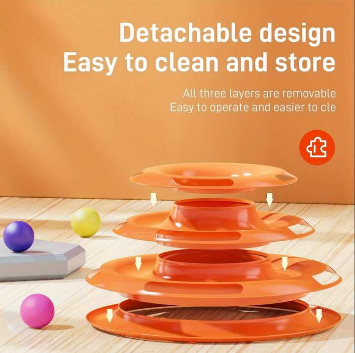 A happy cat playing with a 3-tier interactive ball toy tower. Excellent for active felines & enrichment.