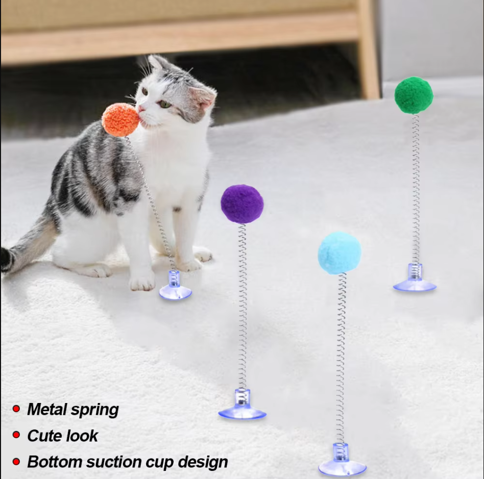 Suction cup cat toy with colorful feathers, perfect for solo interactive play & kitten fun.