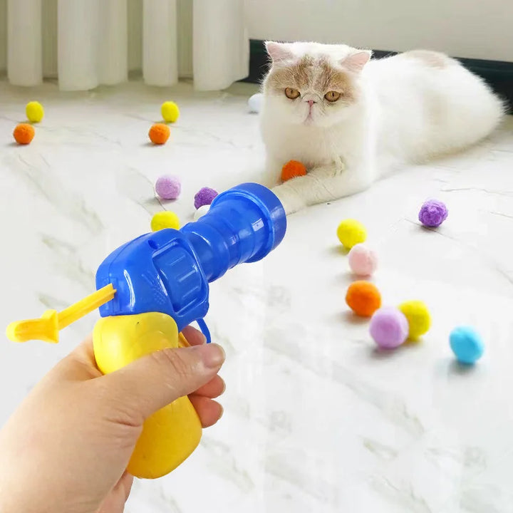 Interactive cat toy cannon launches soft balls, providing endless feline fun & enrichment for playful pets.