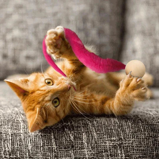 Dynamic interactive cat toy with a bell and wagging tail, designed for exciting cat exercise & fun.