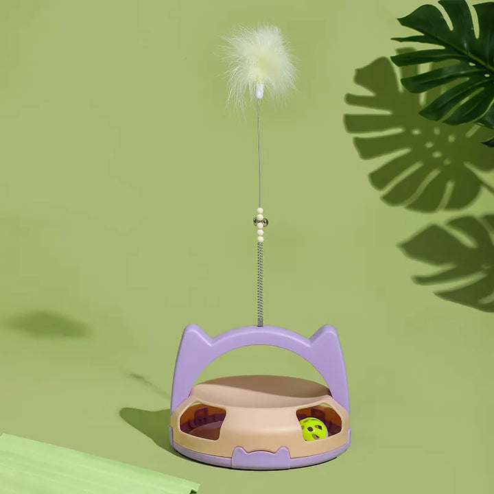 Dynamic cat enrichment toy with an enticing feather and a spinning rolling ball.