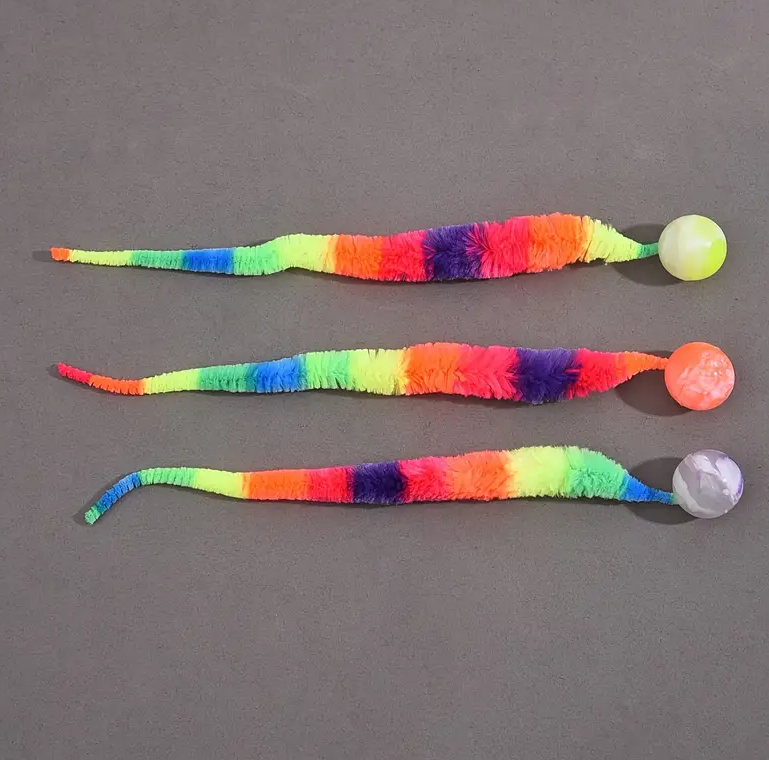 Feline interactive play toy featuring a soft plush tail and stimulating ball, great for stress relief.