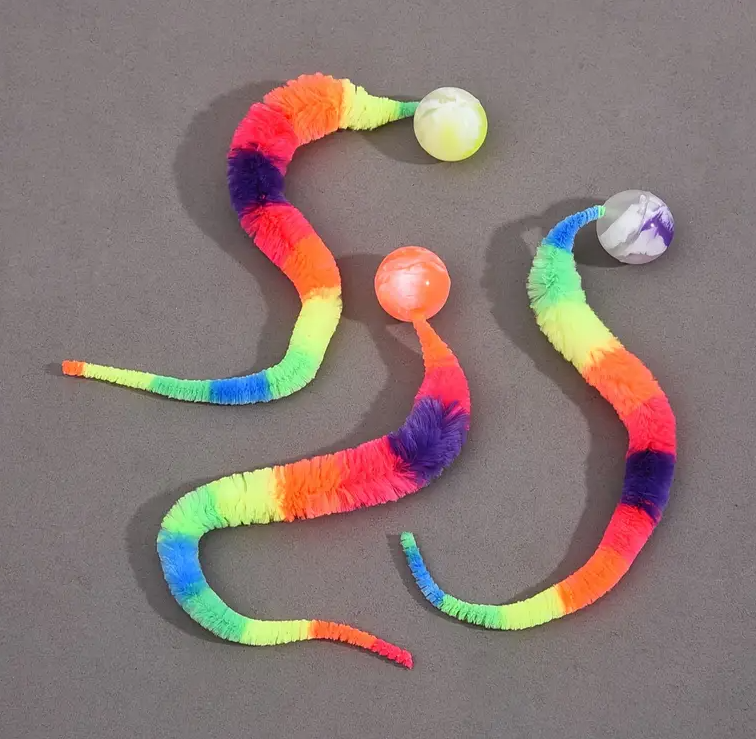 Engaging cat ball toy with a long plush tail, designed for active pet entertainment and enrichment.