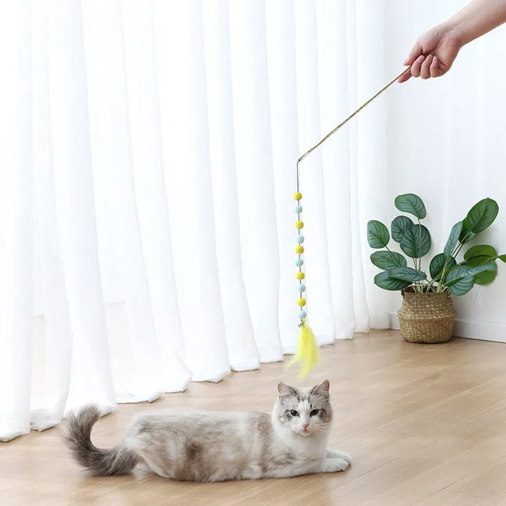 Interactive cat wand toy with colorful pompoms & real feathers, perfect for kitten & active cat play. A boredom buster!