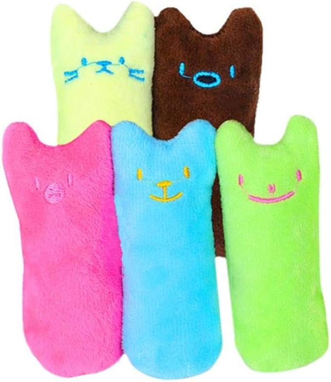 Kitten enjoying a stimulating catnip chew toy; great for kitten play & development.