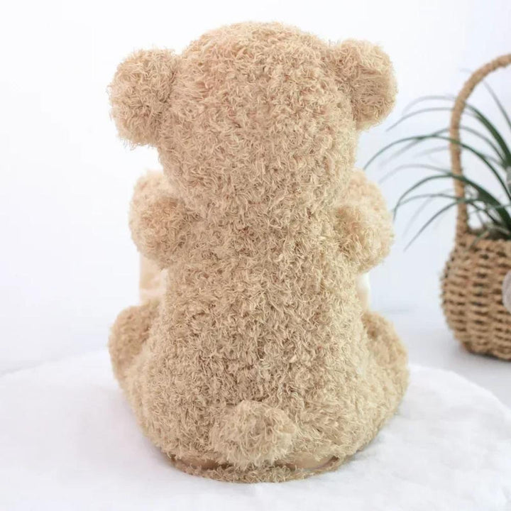 Unisex baby gift: Interactive teddy bear plush that plays peek-a-boo, ideal for sensory play.