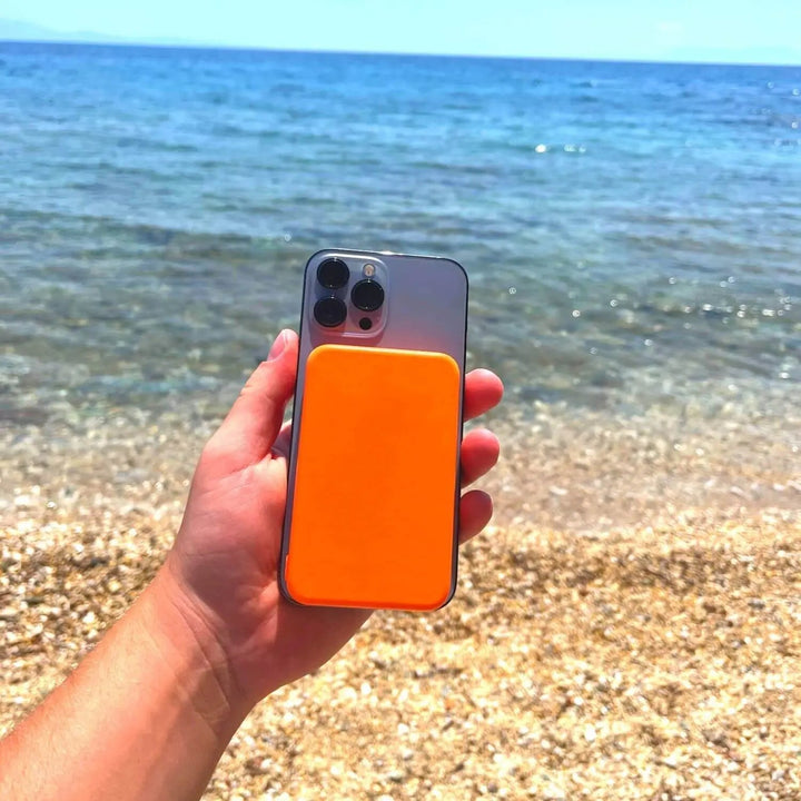 Designed for iPhone: magnetic wireless portable charger, a compact external battery.