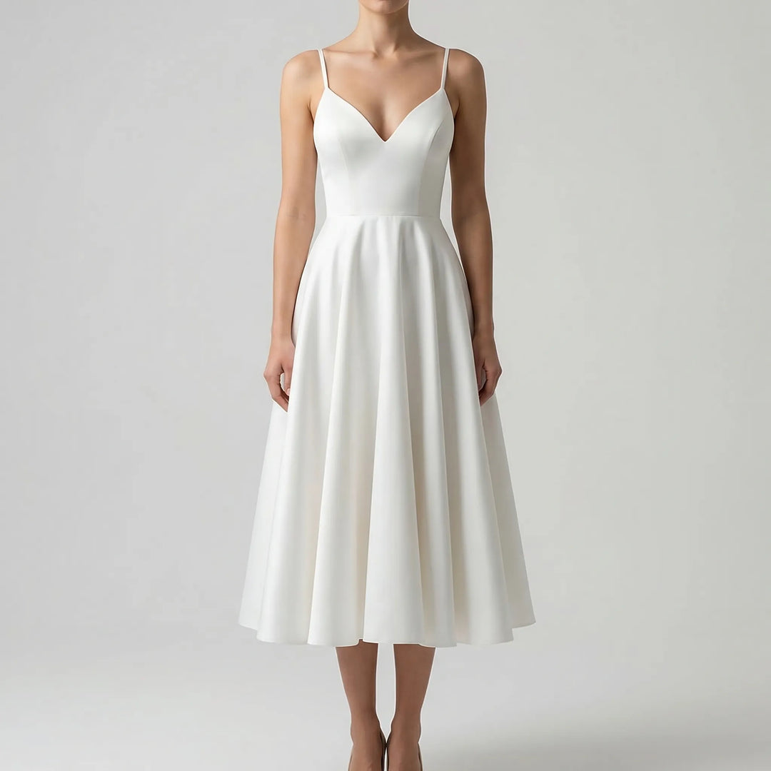 A-line wedding guest dress featuring a flattering sweetheart neckline and straps.