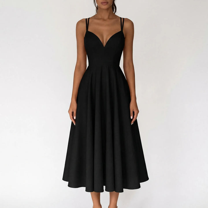 Special occasion ivory midi dress with strappy design and sweetheart bodice.