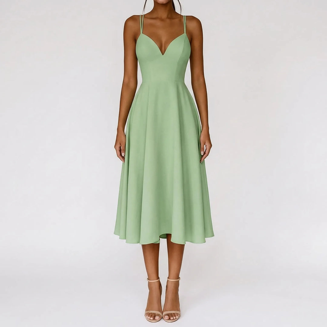 Strappy ivory midi dress showcasing a romantic sweetheart neckline, ideal for events.
