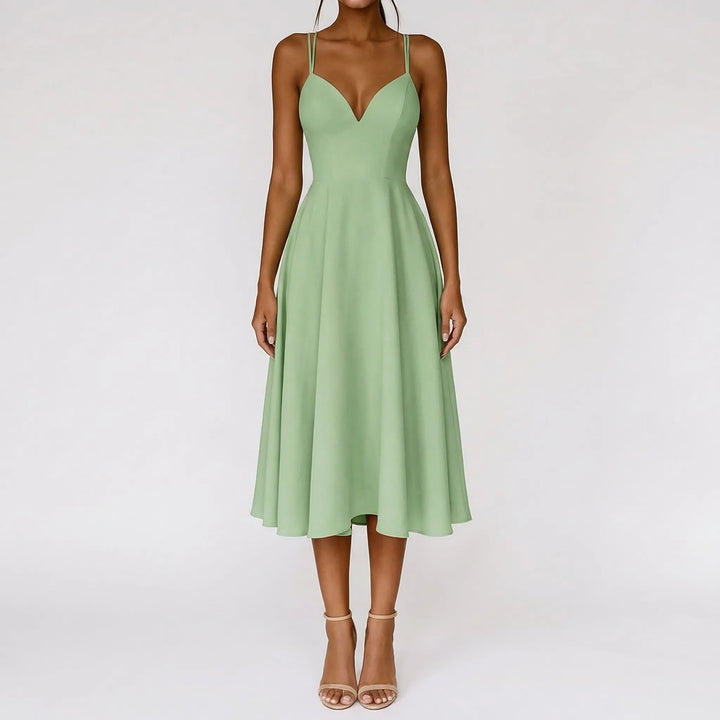 Strappy ivory midi dress showcasing a romantic sweetheart neckline, ideal for events.
