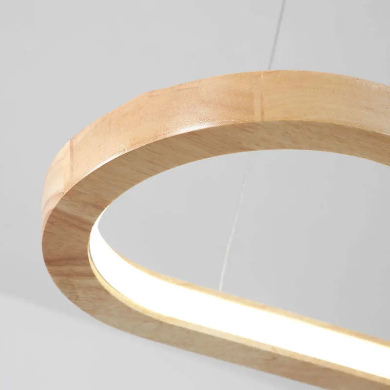 Beautiful oval pendant light with wooden accents and LED for kitchen island & modern dining decor.