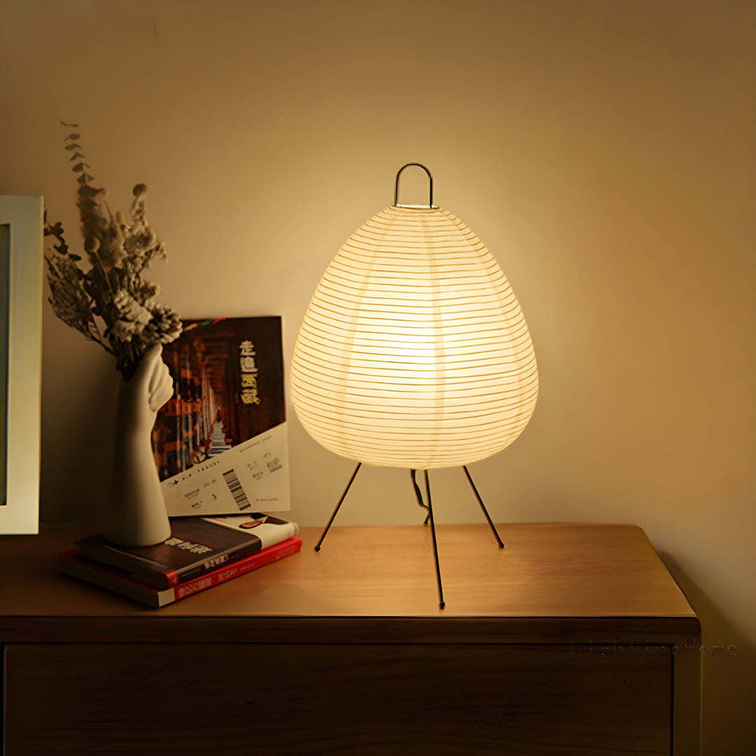 Elegant Wabi-Sabi rice paper table lamp, minimalist design; creates soft, warm ambient light for any room.
