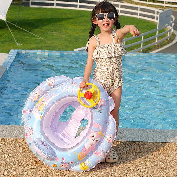 Green steering wheel float for children, promoting active and imaginative outdoor play.