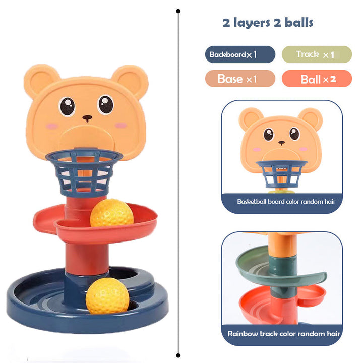 Toddler playing with educational ball drop tower, developing motor skills
