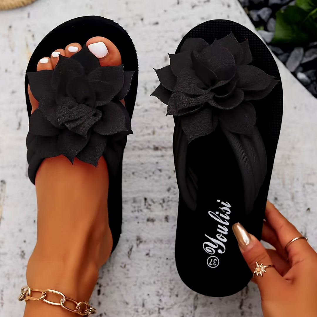 Stylish ladies' wide fit platform flip flops with a pretty floral design for summer.