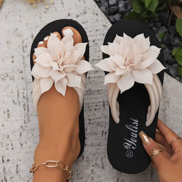 Durable EVA sole wide fit platform flip flops for ladies, featuring a beautiful floral accent.
