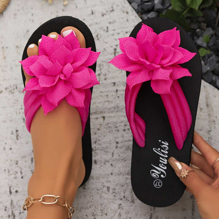 Wide fit platform flip flops with an EVA sole and floral detail, ideal for women's summer wear.