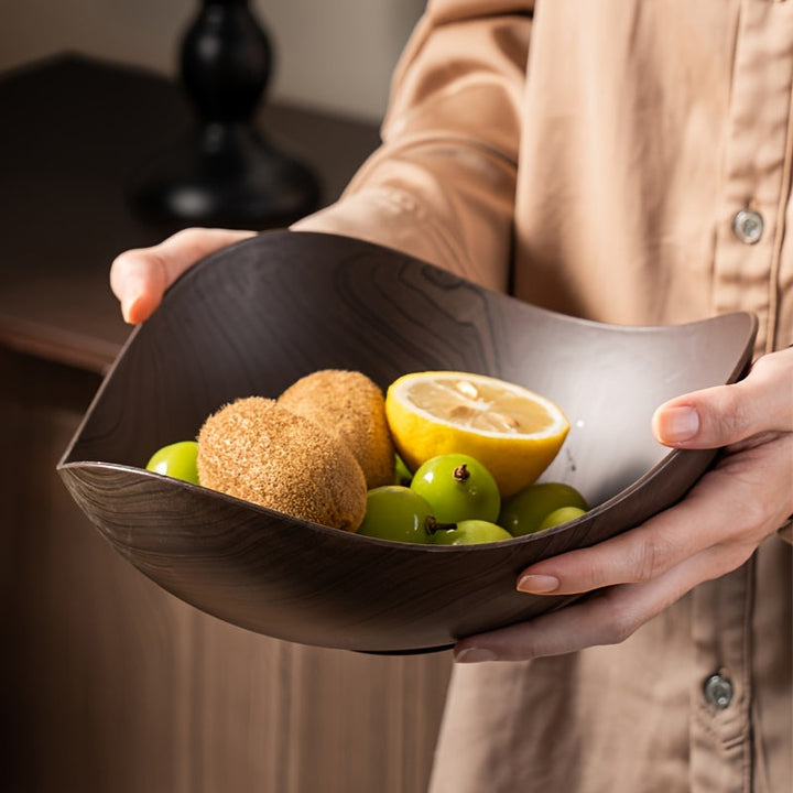 Elegant polypropylene fruit bowl with natural wood look, ideal table centerpiece.
