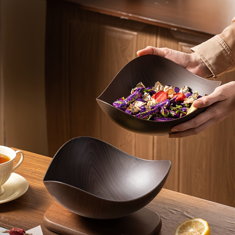 Organic design wood-look fruit bowl, a stylish home essential for any modern kitchen table.