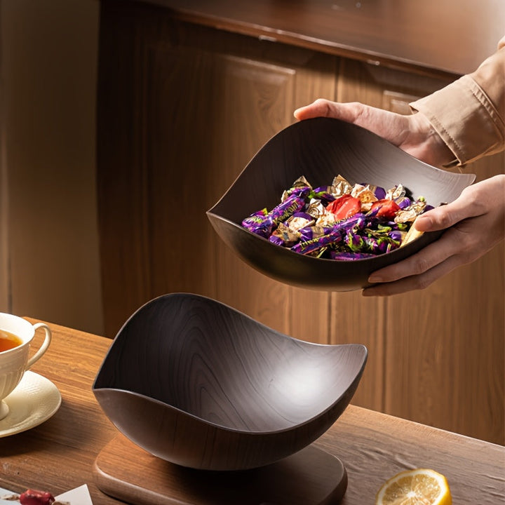 Organic design wood-look fruit bowl, a stylish home essential for any modern kitchen table.