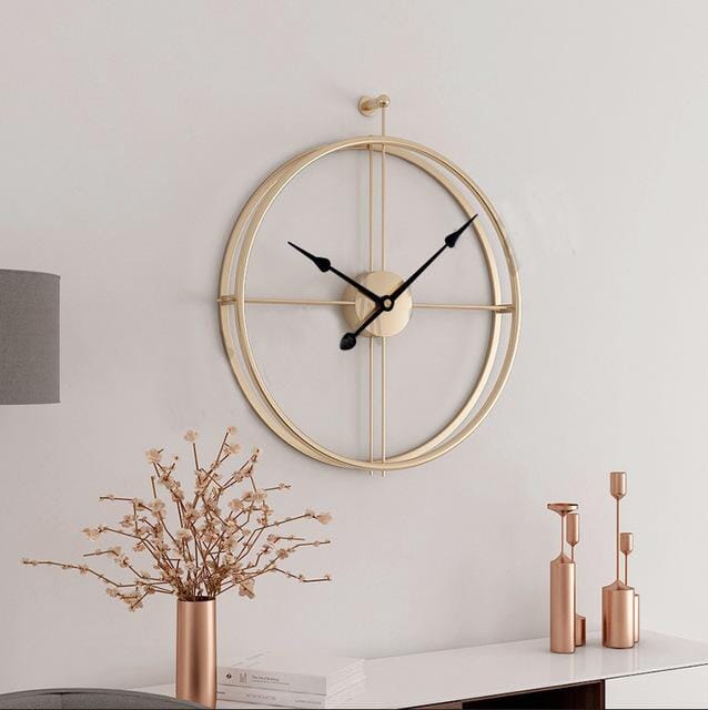 Elegant gold geometric metal wall clock, large and silent. Luxury modern decor for stylish interiors.
