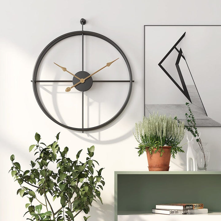 Modern black geometric metal wall clock, large silent design. Perfect statement piece for home/office.